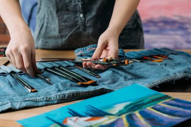 A person sewing colorful patches onto a denim jacket, showcasing the upcycling trend and how to give old clothes a new life through creative customization.