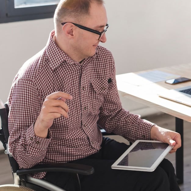 A person in a wheelchair is using a tablet to design a custom-fit outfit with the help of 3D modeling software. The screen shows the 3D model of the garment being adjusted to their specific measurements.