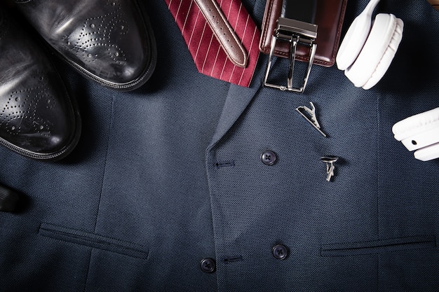 A collage showing essential wardrobe items for a professional look: a tailored blazer, a classic white shirt, a pencil skirt, and a pair of versatile pumps. Each item is displayed against a neutral background.