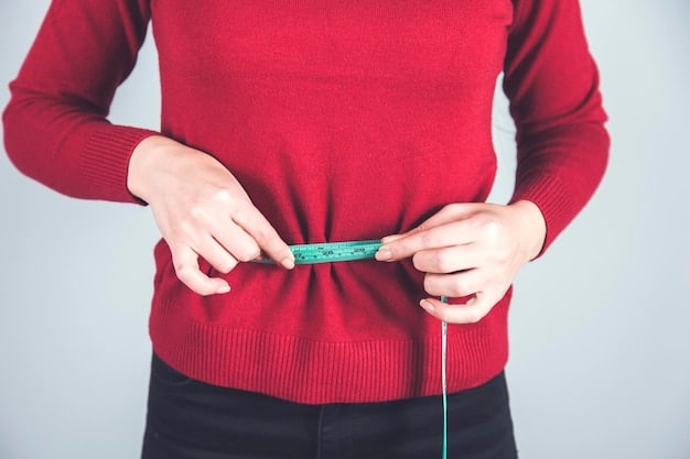A close-up view of a measuring tape being used to accurately measure a person's waist. The focus is on the numbers on the tape and the fabric being measured, showcasing precision and attention to detail.