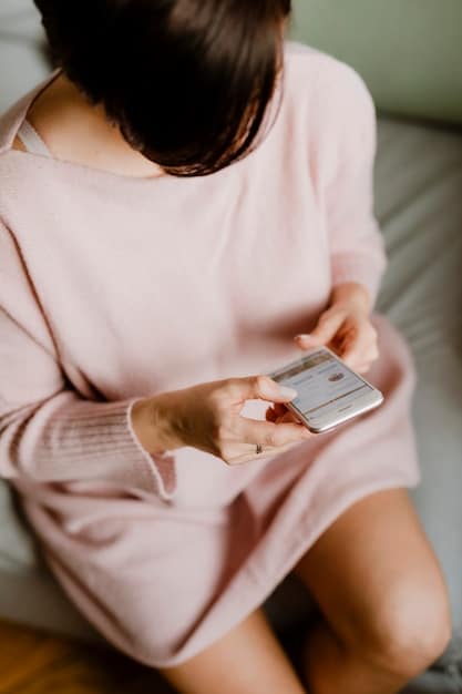 A close-up shot of a woman's hands holding a smartphone, where the Shein app is open, displaying a selection of evening dresses with prices clearly visible. The background should be blurred to focus on the app interface.