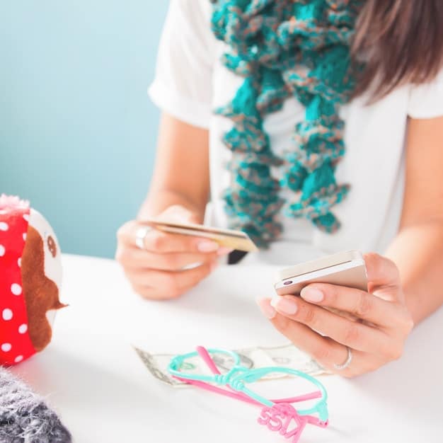 A close-up of a French influencer's hands mending a small tear on a Shein blouse with colorful thread, demonstrating simple sewing skills. The backdrop is a sewing kit with various tools and fabrics.