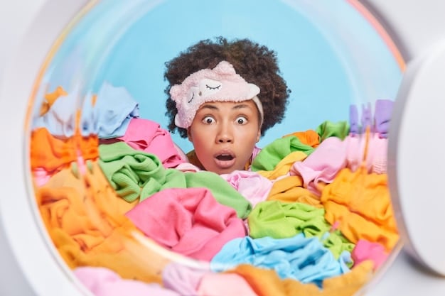 A washing machine with a mesh laundry bag inside, filled with colorful sweaters, illustrating the practice of using a laundry bag to protect clothes during washing.