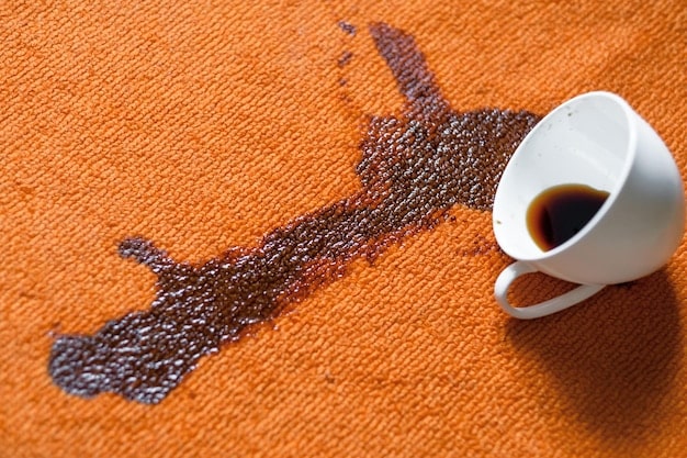 A detailed image showcasing various common stains on different types of fabric, such as coffee stains on cotton, wine stains on linen, and oil stains on denim. Each stain is clearly visible and labeled.