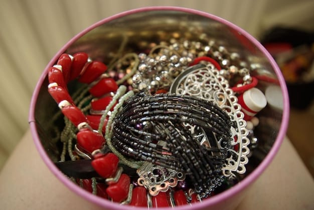 A neatly organized jewelry box with multiple compartments, showcasing various Shein jewelry items like necklaces, earrings, and bracelets, each separated and protected from touching.