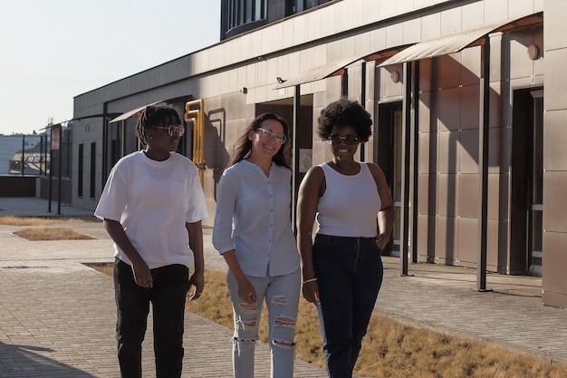 A diverse group of people standing in front of a newly built affordable housing complex, symbolizing community and inclusion. The building has a modern design and integrates green spaces.