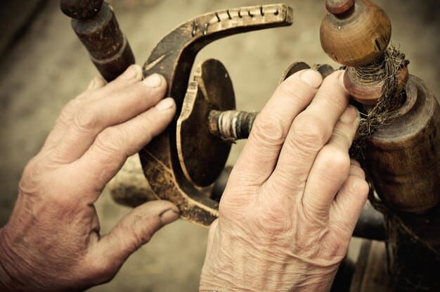 Close-up photo of aging hands working on skilled trades, implying labor scarcity and the challenge of finding new workers to replace the retiring generation. Focus on hands, tools, and the concept of aging workforce.