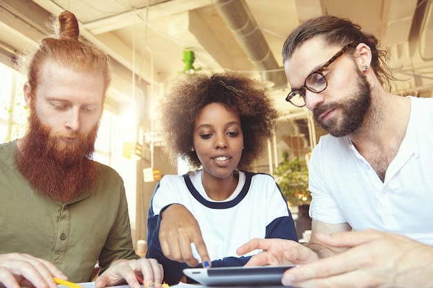 Close-up of a diverse group of people working together in a modern office, showcasing collaboration and teamwork.