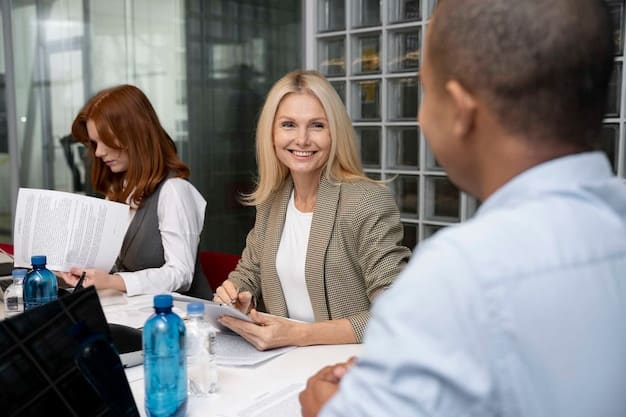 A diverse group of financial advisors meeting with clients in a modern office. The advisors are explaining charts and tax documents to the clients.