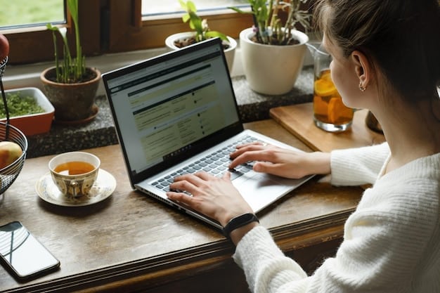 A person sitting at a desk, using a laptop to access the CAF website and apply for Prime d'activité. The focus should be on the screen displaying the application form.