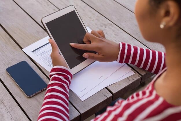 A person using a tablet to fill out an online form for RSA application. The background shows a modern, minimalist home office setup, emphasizing the ease and accessibility of digital application processes.