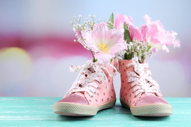 A close-up shot of pastel-colored sneakers arranged against a backdrop of blooming flowers, emphasizing the contrast between nature and footwear fashion.