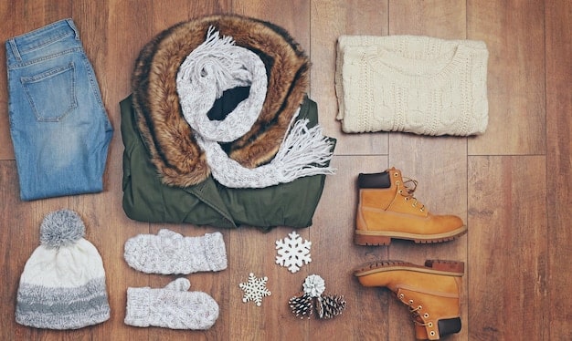 A visual representation of a winter capsule wardrobe, showcasing a variety of warm and cozy pieces like a wool coat, cashmere sweater, dark wash jeans, and insulated boots, all in a neutral color palette of black, gray, and white.