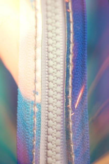 A detailed view of smart fabric leggings with embedded sensors visibly woven into the material, connected to a small data processing unit. The image highlights the intricate integration of technology within the fabric, showcasing the seamless blend and non-intrusive design that allows for comfortable and accurate performance monitoring during athletic activities.