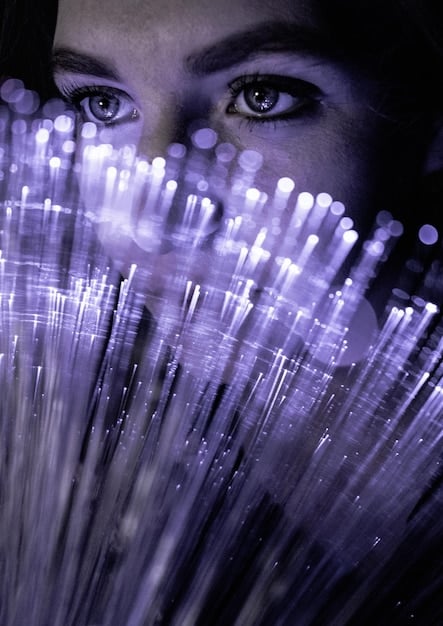 A close-up shot of a digital avatar wearing a highly detailed, shimmering virtual dress, showcasing intricate textures and dynamic particle effects in a virtual environment.