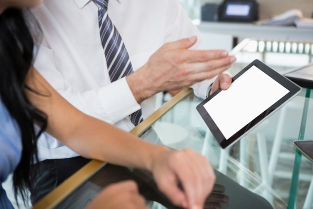 A sales associate using a tablet to assist a customer in front of an AR mirror. The tablet displays additional product information and styling tips, enhancing the personalized shopping experience. The customer is engaged and smiling.
