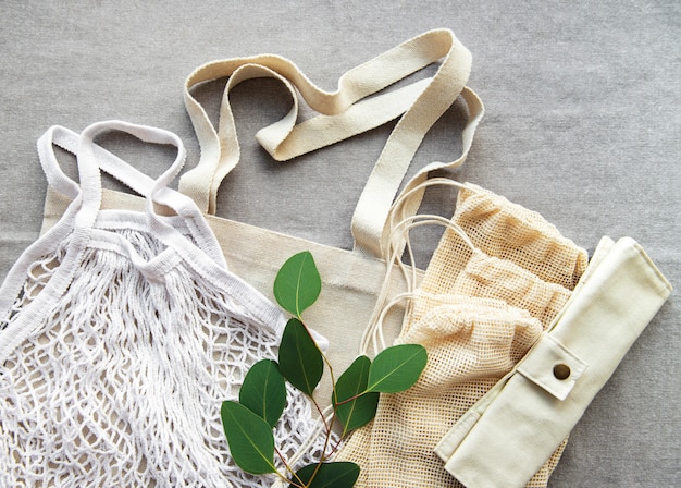 A display of sustainable fashion items in a retail store, featuring clothing made from recycled materials and organic cotton. Information panels highlight the eco-friendly production processes and the ethical sourcing of materials. The overall aesthetic is natural and minimalist, emphasizing the brand's commitment to sustainability.