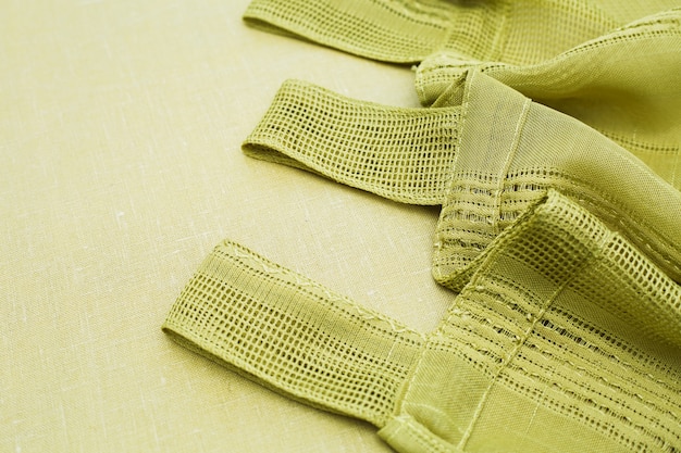 Close-up shot of the fabric and stitching of a Shein plus-size dress. The image should showcase details that indicate low-quality construction like loose threads or uneven seams.