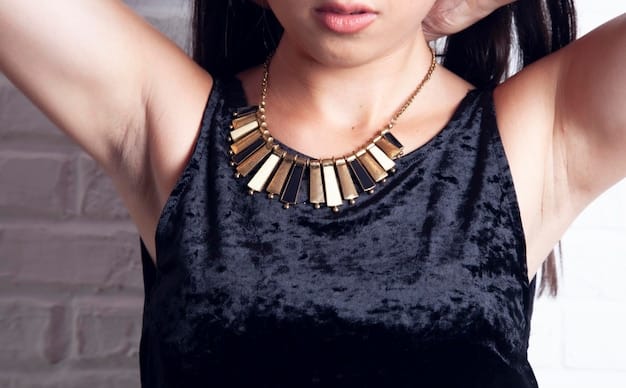 A close-up shot of a model wearing a Shein statement necklace with geometric shapes and bright colors. The necklace is paired with a simple black top, highlighting the necklace's impact. The focus is on the intricate details and the modern design of the jewelry.
