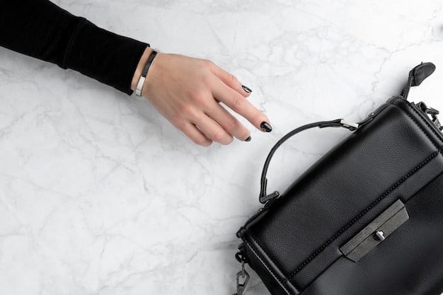 A close-up shot of a woman's hands, showcasing elegant and minimal accessories, such as a watch, a simple ring, and a structured handbag, complementing a Shein workwear outfit.