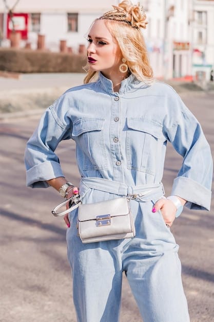 A young woman wearing a stylish outfit and a Shein crossbody bag, standing against a colorful urban backdrop. The bag is perfectly sized and complements her outfit, adding a touch of practicality and flair.