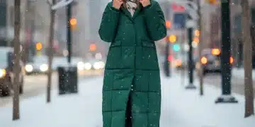 Woman in emerald green SHEIN puffer coat walking in snowy city