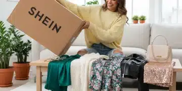 Stylish woman excitedly unboxing Shein haul 2026, surrounded by new trendy clothes and accessories.