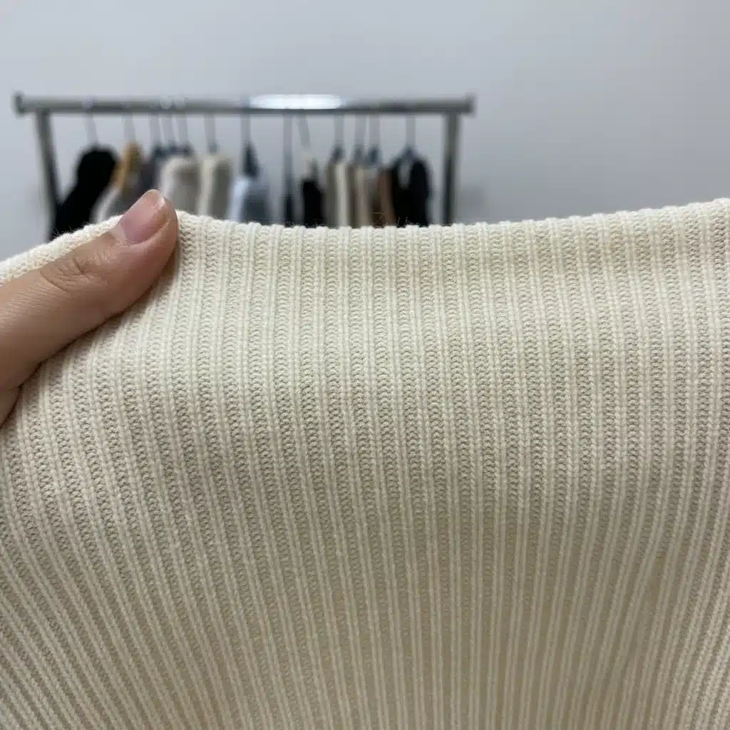 Close-up of Shein knit top fabric detail, showing texture and stitching quality.